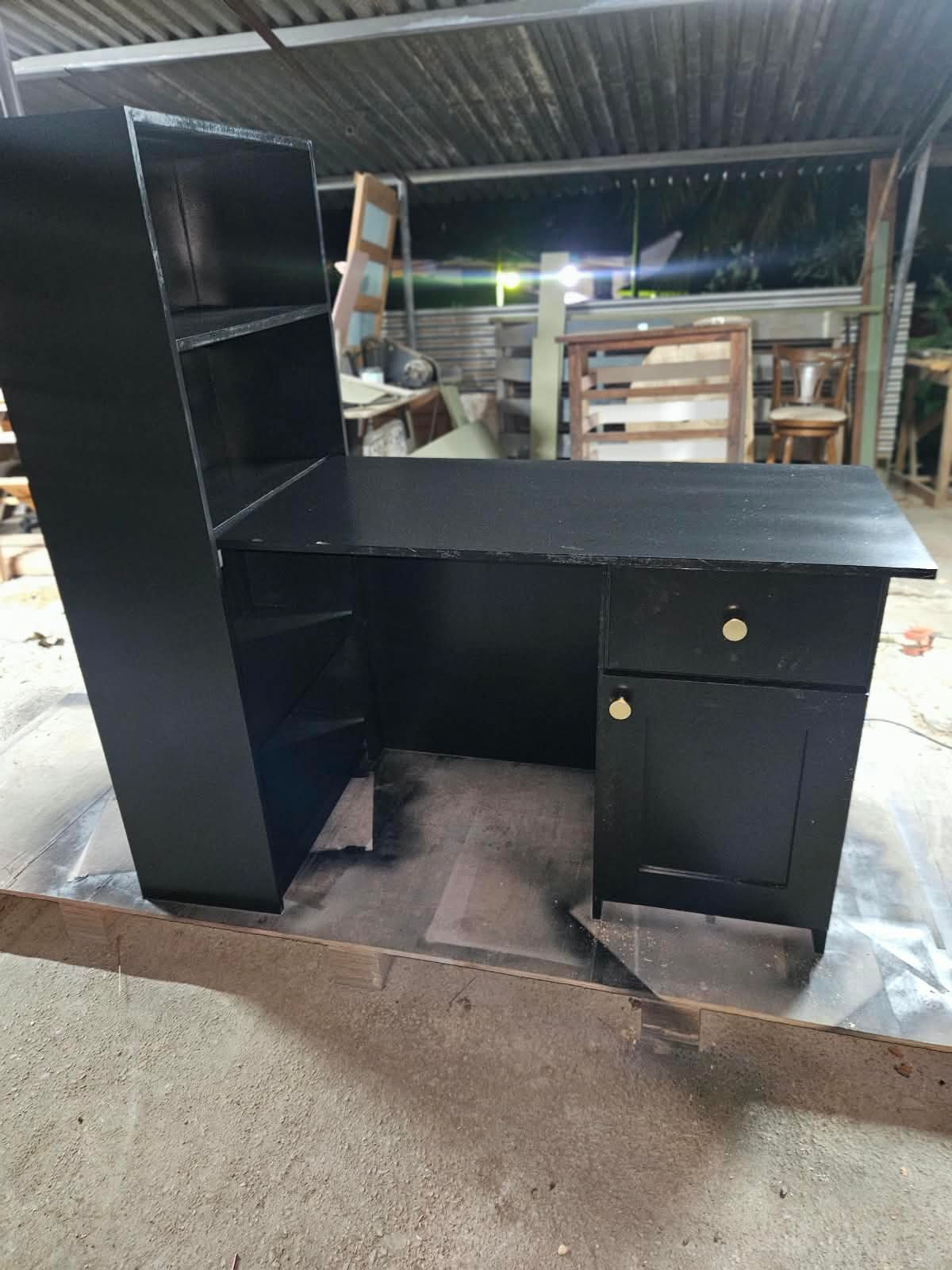 Custom black office desk with shelving and drawer storage photographed in the Build247 workshop